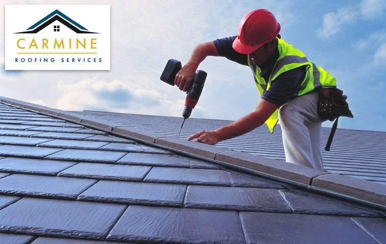 Close-up of roofers working on Gerard roofing system installation