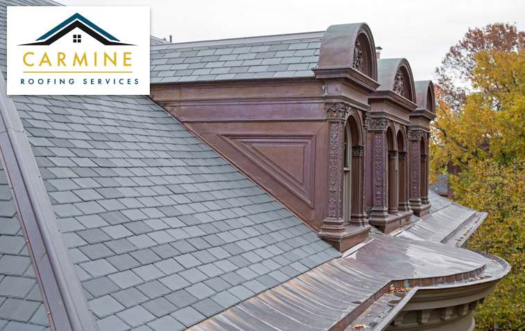 Completed composite slate roofing on a residential house